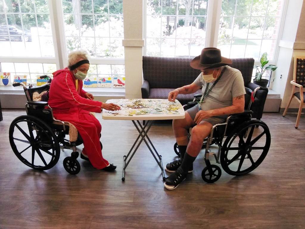 two residents making a puzzle